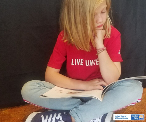 little girl reading